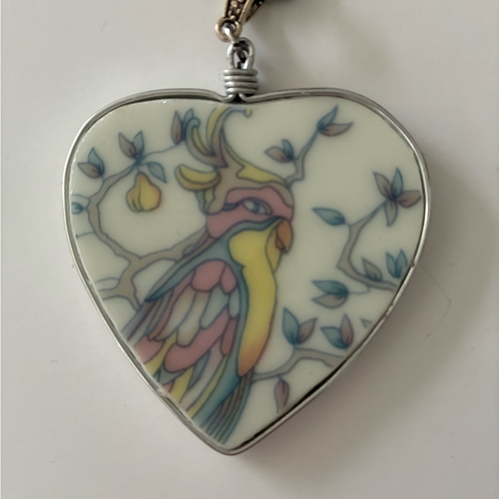 Charming Porcelain Heart Pendant with Cockatoo Design (with chain) $55.